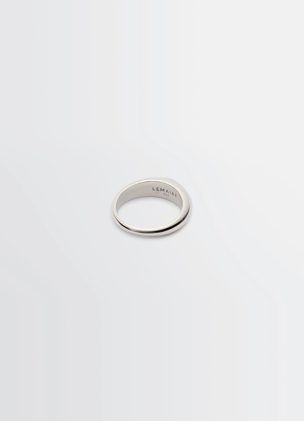Lemaire Drop Ring in Rhodium-plated Silver, product shot, three-quarter view engraved interior lettering
