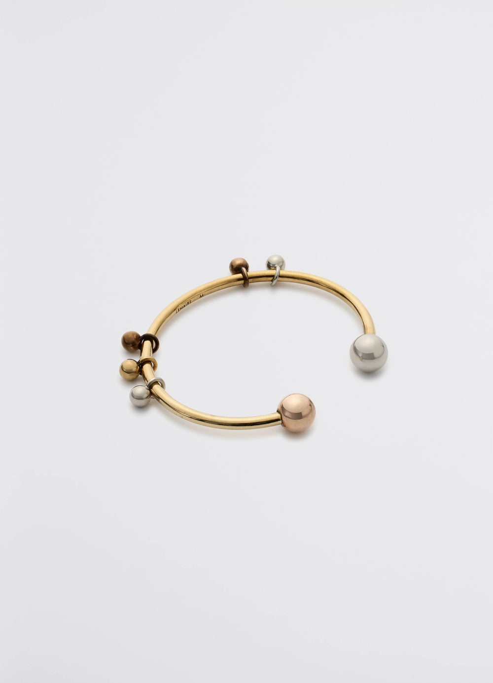 Lemaire Rattle Cuff in Brass with silver, copper and gold, product shot, Angled top view Sculptural with spheres