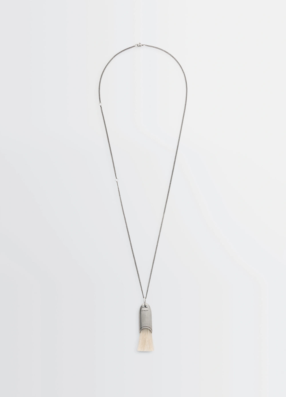Lemaire Personal Brush Necklace in Silver and Beige, product shot, Front view Pendant with brush detail