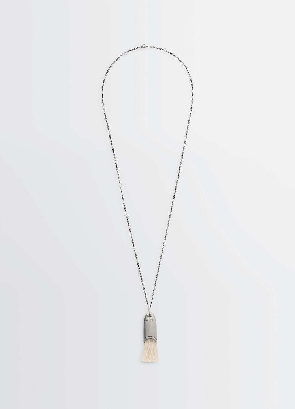 Lemaire Personal Brush Necklace in Silver and Beige, product shot, Front view Pendant with brush detail