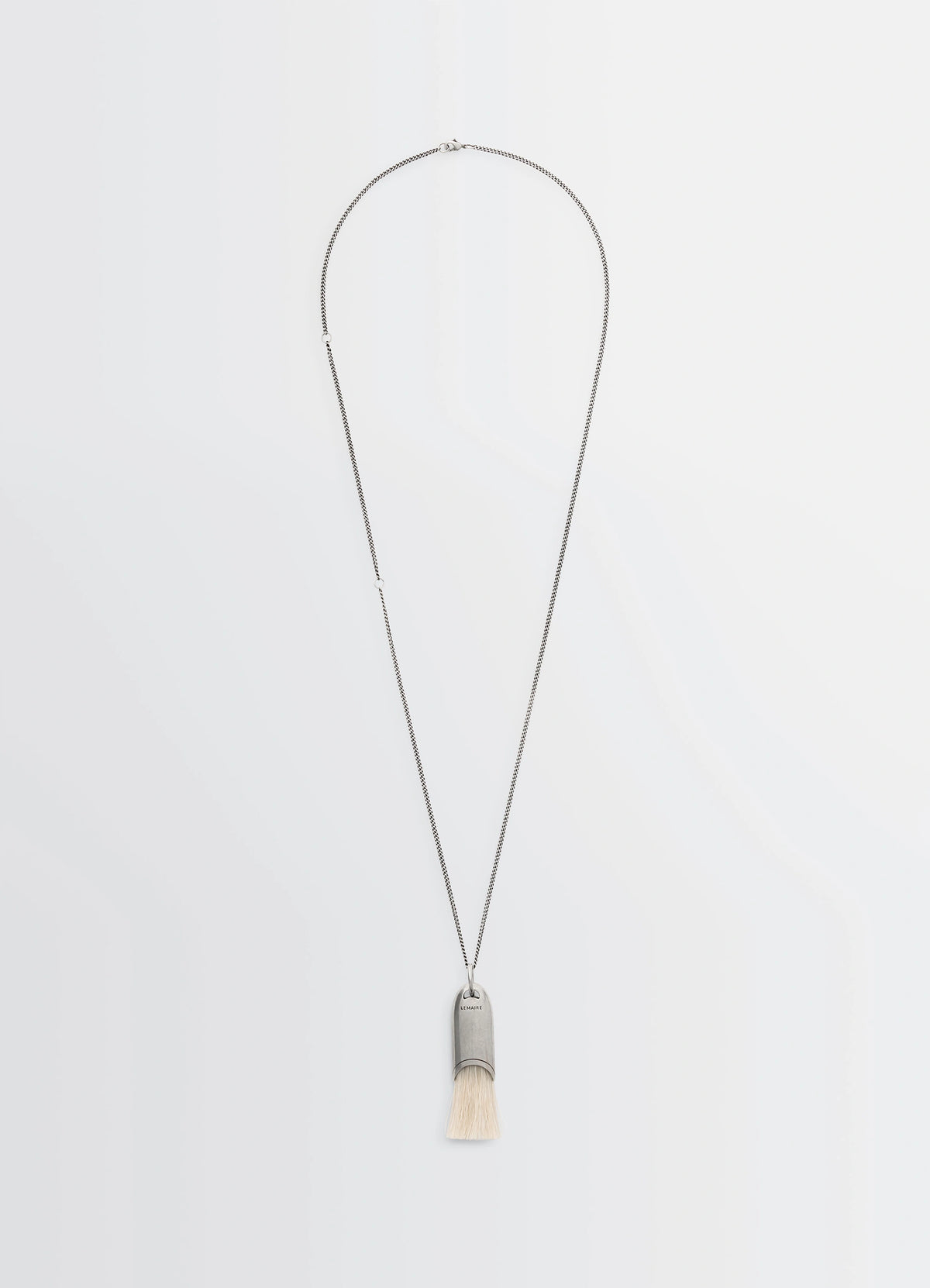 Lemaire Personal Brush Necklace in Silver and Beige, product shot, Front view Pendant with brush detail