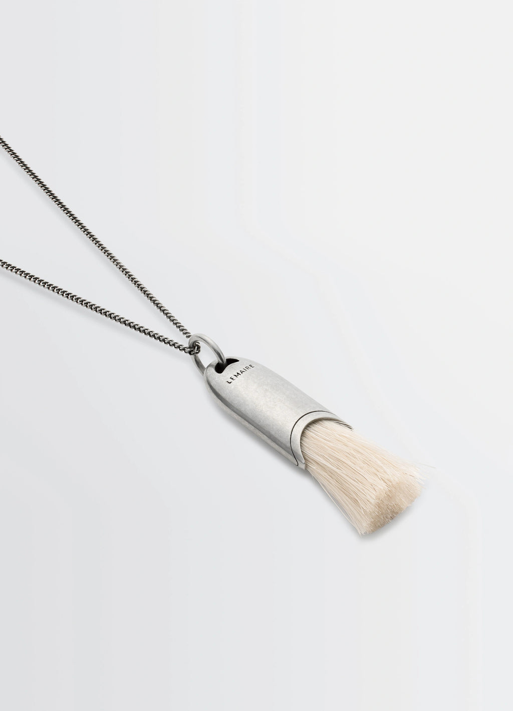 Lemaire Personal Brush Necklace in Silver and Beige, product shot, angled side view chain neckline detail