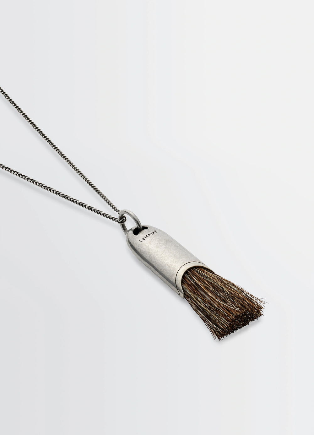 Lemaire Personal Brush Necklace in Silver and Brown Brush, product shot, angled side view chain detail focus