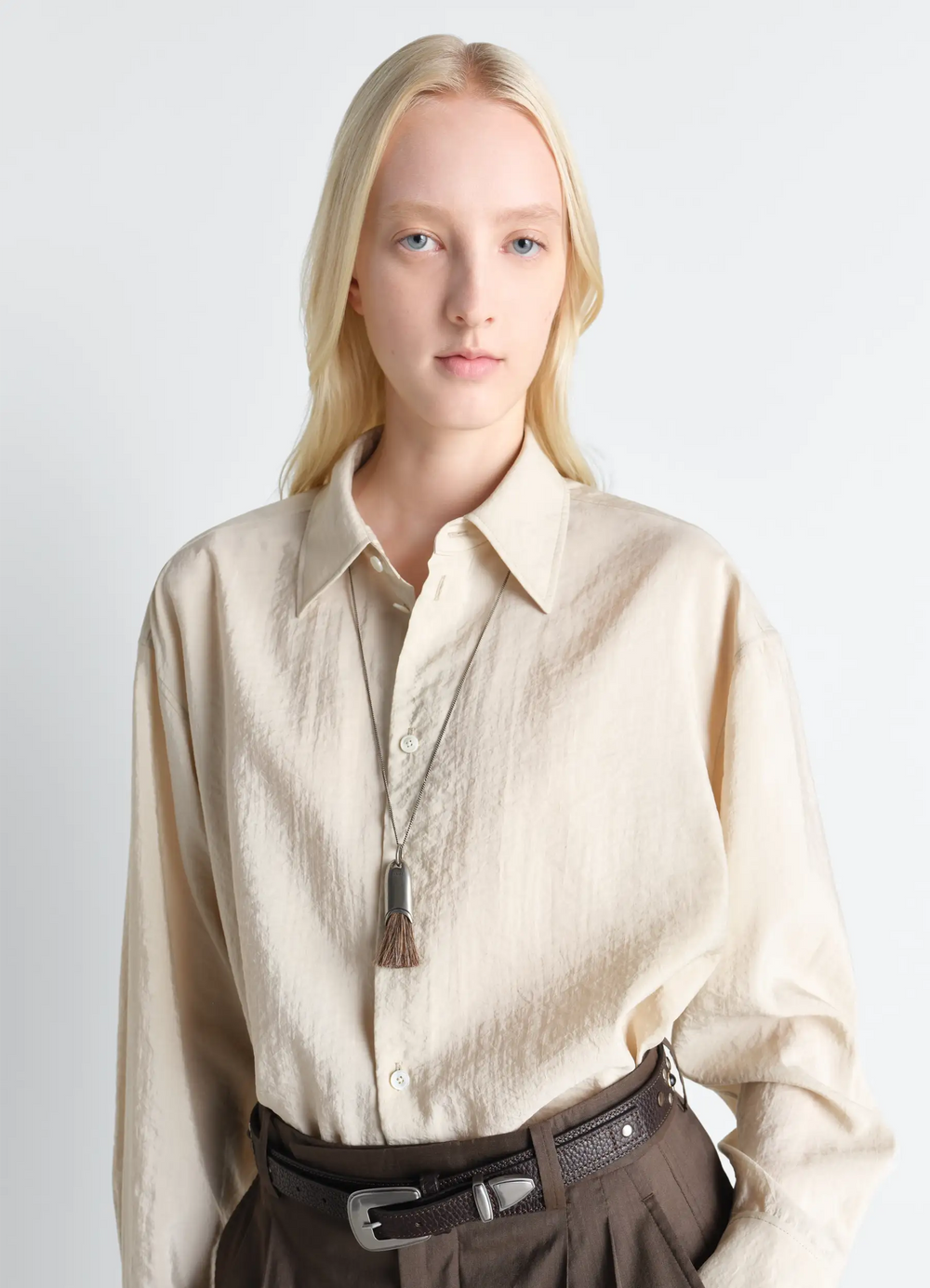 PERSONAL BRUSH NECKLACE in Silver and Brown, model shot, mid-length view worn over shirt