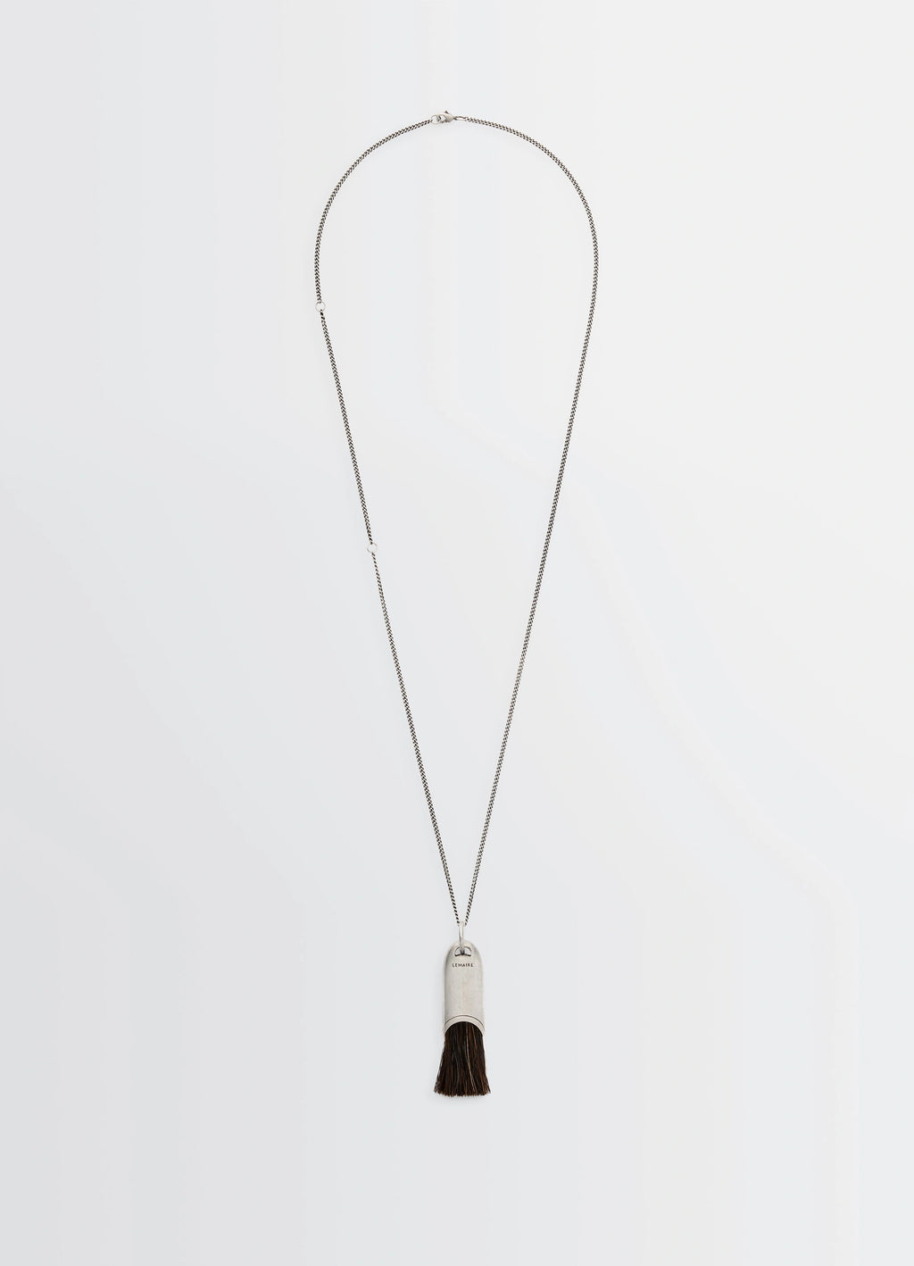 Lemaire Personal Brush Necklace in Silver and Dark Brush, product shot, front view brush pendant detail