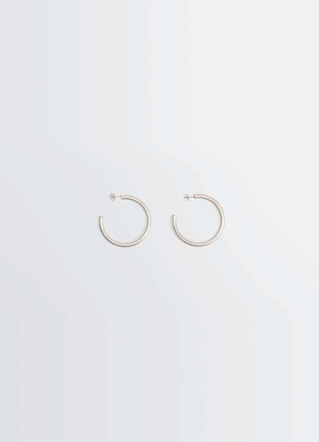 Lemaire Classic Hoops M in Recycled Rhodium-Plated Silver, product shot, Front view Medium-sized hoops