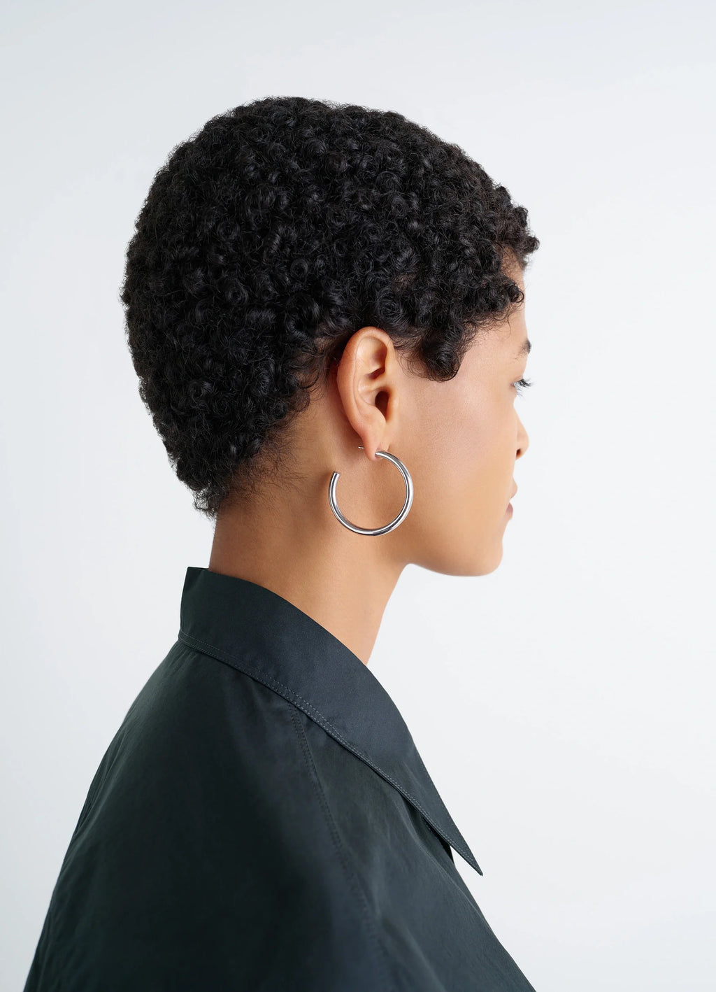 Lemaire Classic Hoops M in Recycled Rhodium-Plated Silver, model shot, side view worn on ear