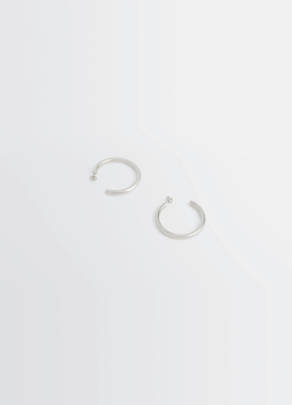 Lemaire Classic Hoops M in Recycled Rhodium-Plated Silver, product shot, top view open-ended design