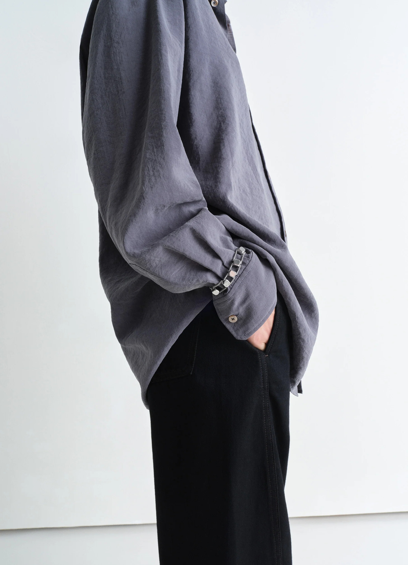 Abacus bracelet in shiny silver brass, model shot, side detail view single row styling
