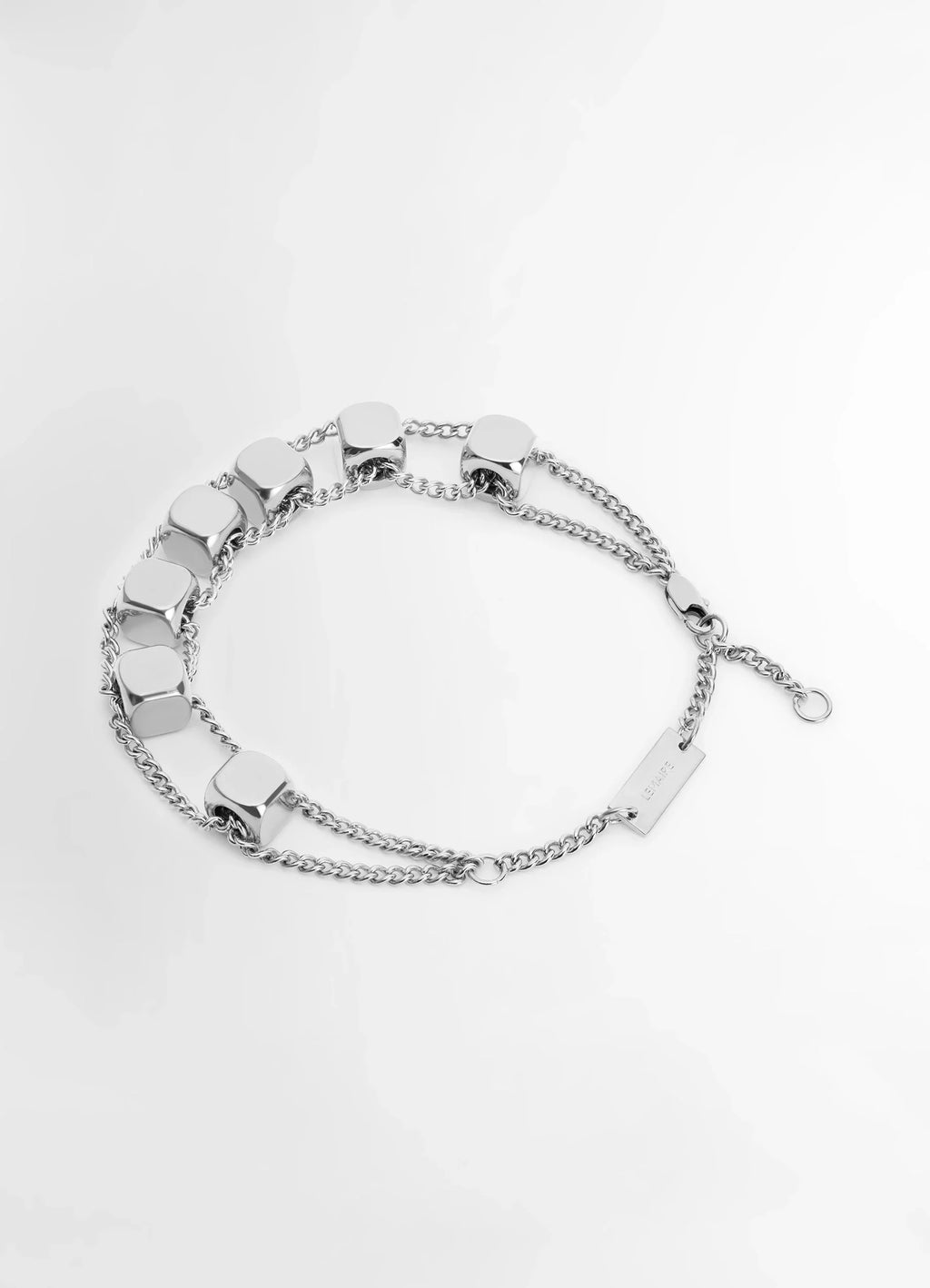 Abacus Bracelet in Shiny Silver Brass, product shot, angled overhead view triple chain links