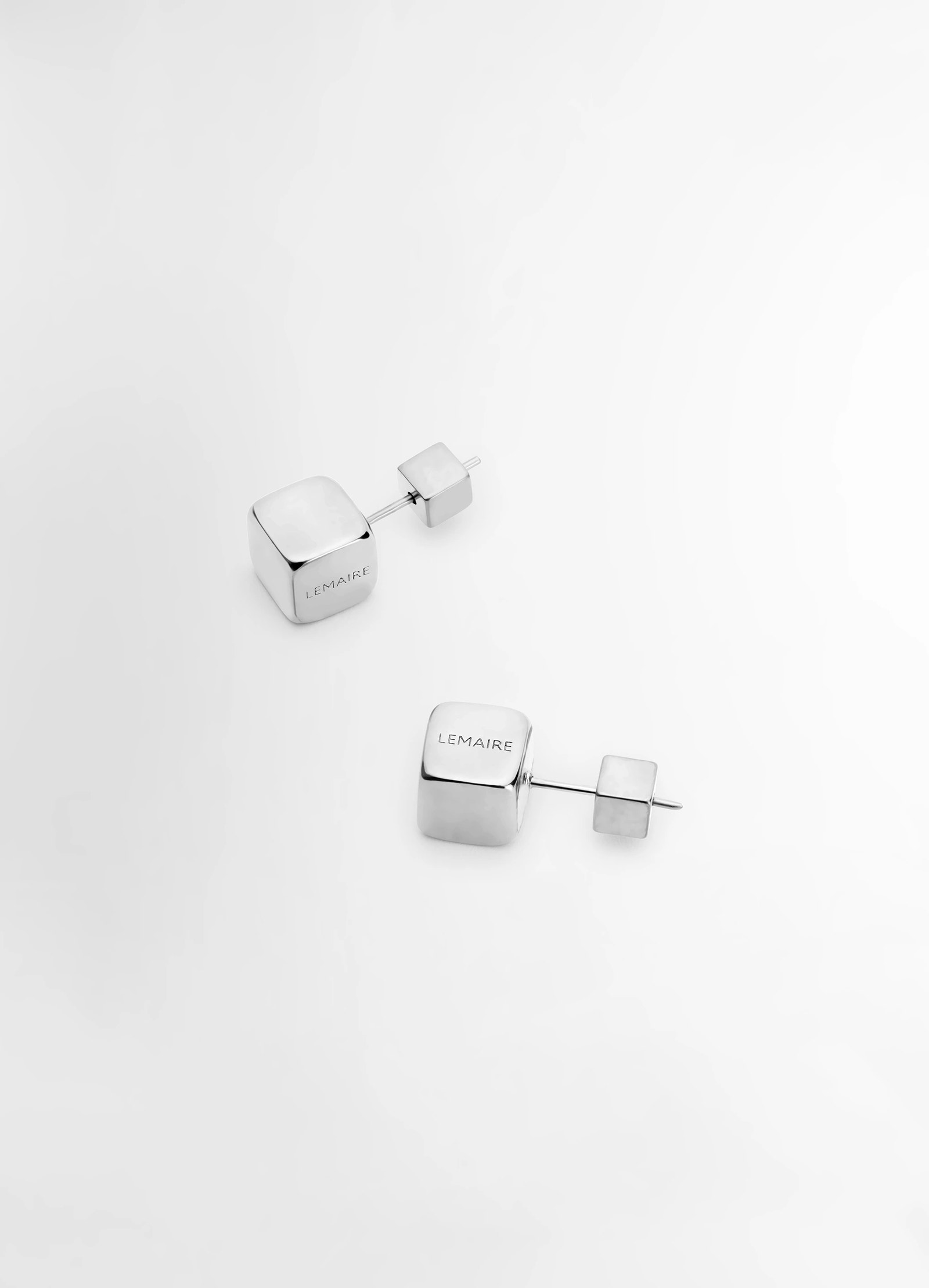 Lemaire abacus earrings in shiny silver brass, product shot, top view engraved branding