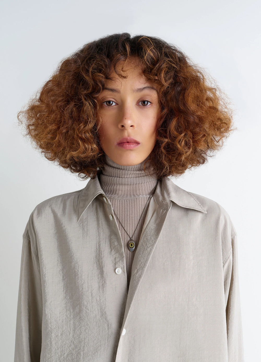 Cat Eye Pendant Necklace in Silver-plated brass, glass, model shot, detail shot worn with button-up shirt