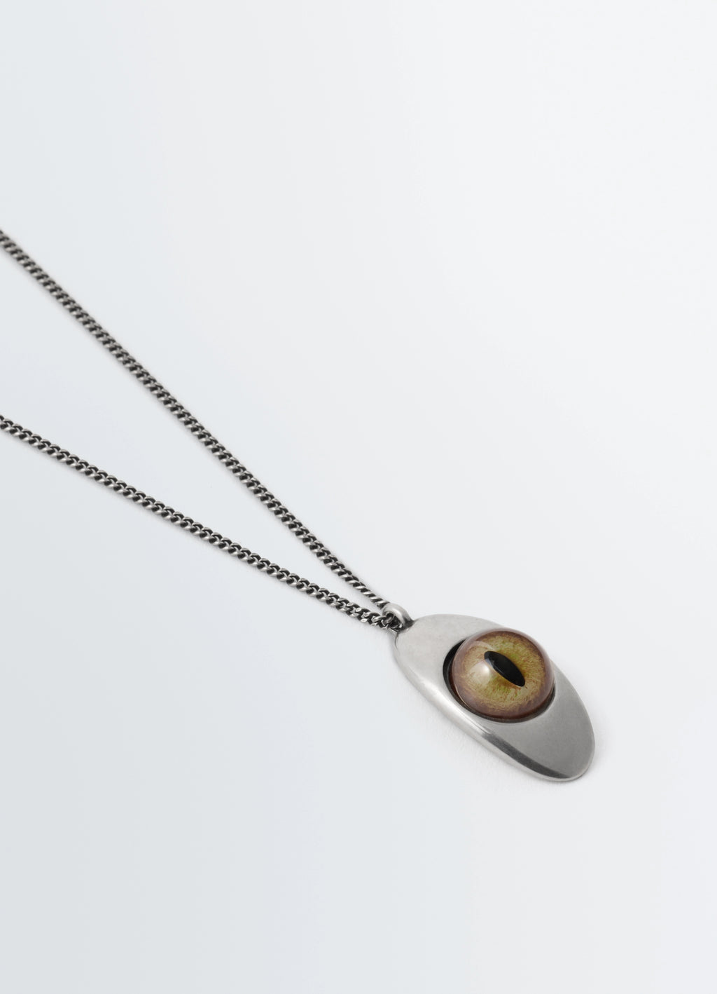 Cat Eye Pendant Necklace in Silver-plated brass, glass, product shot, angled top view minimalist design