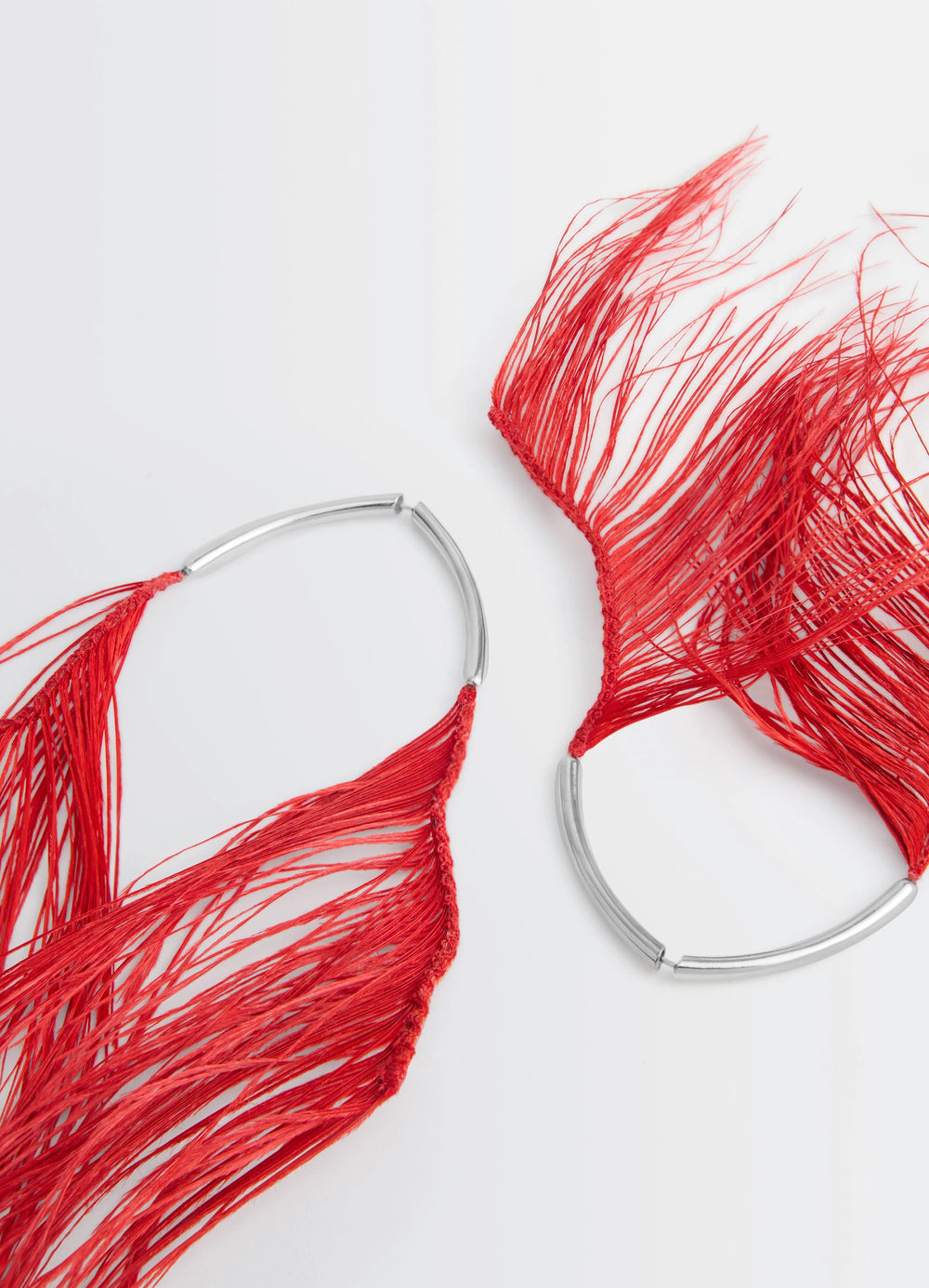 Feather Earrings in Red Ostrich Feathers, product shot, top view silver-plated clasp