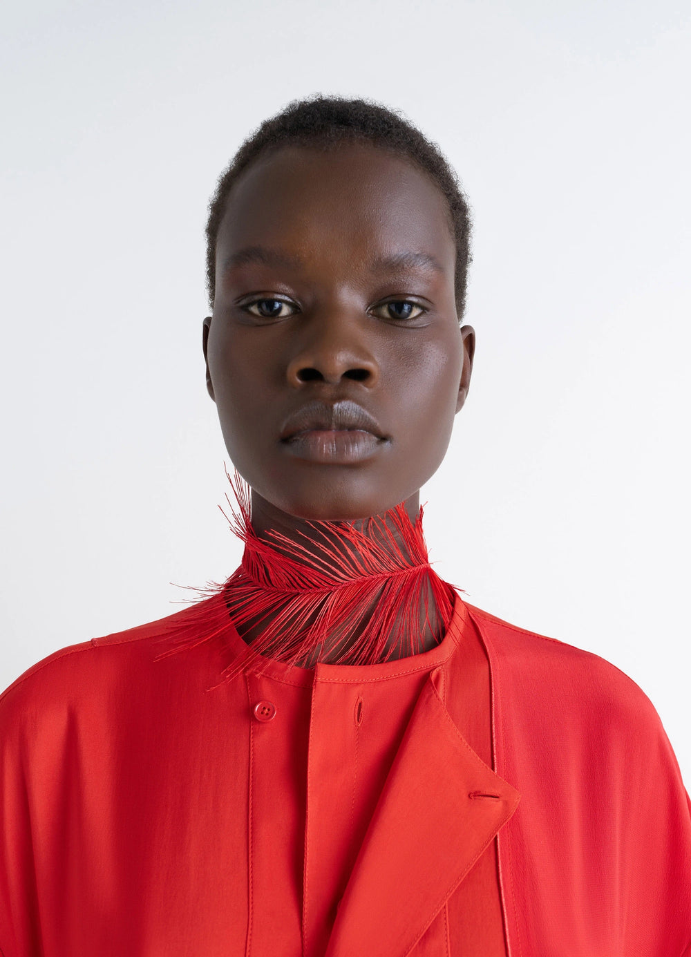 FEATHER NECKLACE in Red Ostrich Feathers, Silver-Plated, model shot, front view close-up feather texture visible