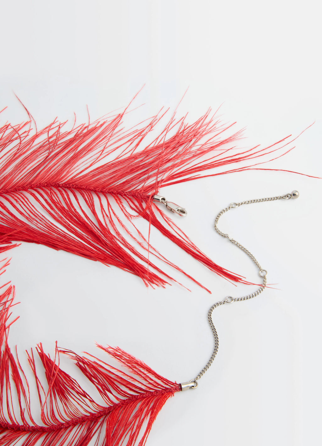FEATHER NECKLACE in Red Ostrich Feathers, Silver-Plated, product shot, angled close-up shot feather and chain detail