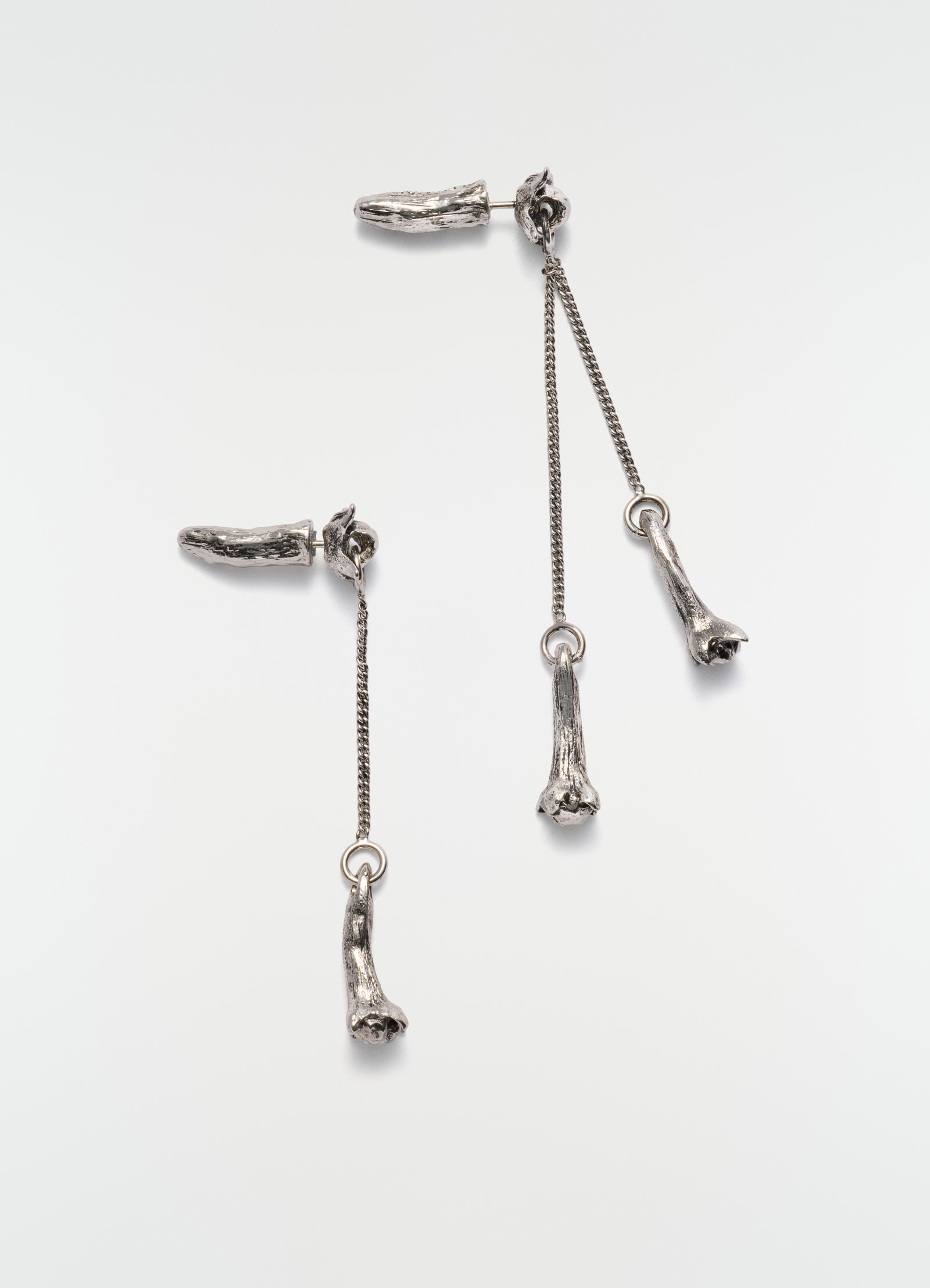 Clove pendant silver metal earrings with chain detail by lemaire on plain white background