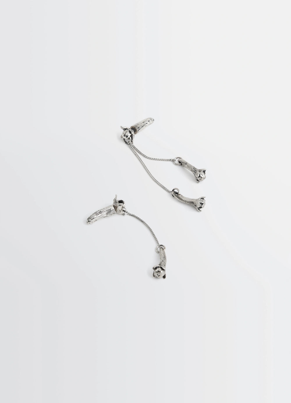 Clove Pendant Earrings in Hammered Patinated Brass, product shot, overhead detail shot fine chain accents