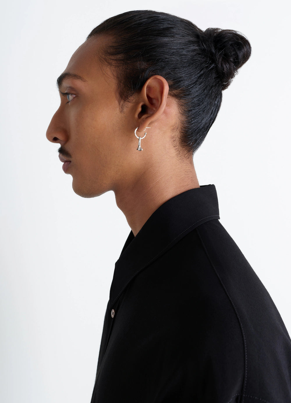 Clove Earrings in Hammered Patinated Brass, model shot, side view worn by model