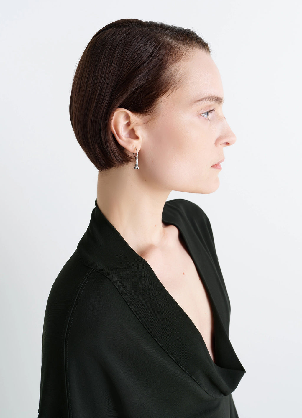 Clove Earrings in Hammered Patinated Brass, model shot, three-quarter view worn with sleek bob