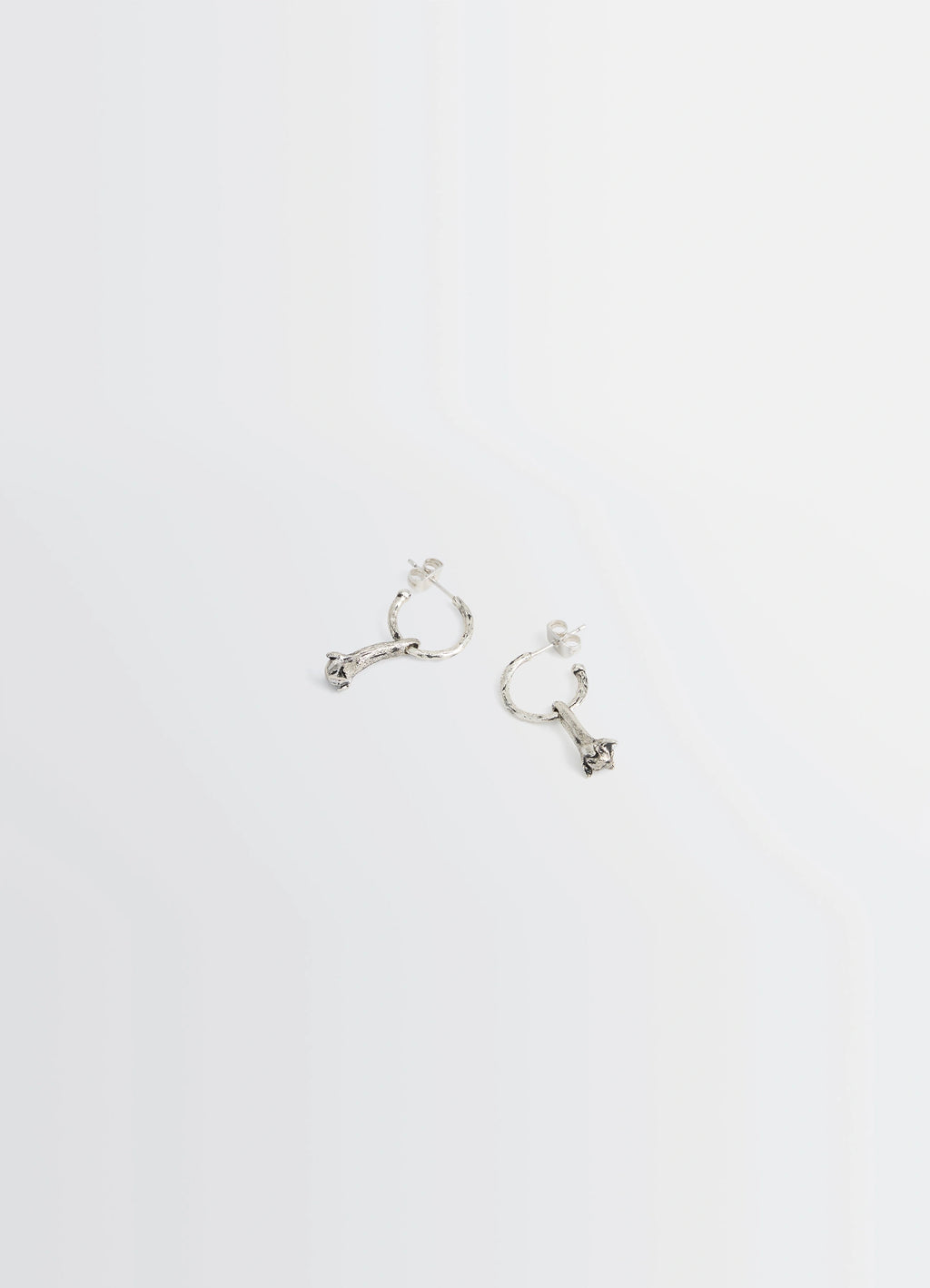 Clove Earrings in Hammered Patinated Brass, product shot, overhead view distinct hammered texture