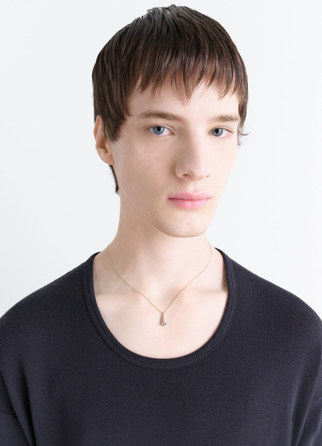 Clove Necklace in Hammered Patinated Brass, model shot, worn close-up view subtle chain styling