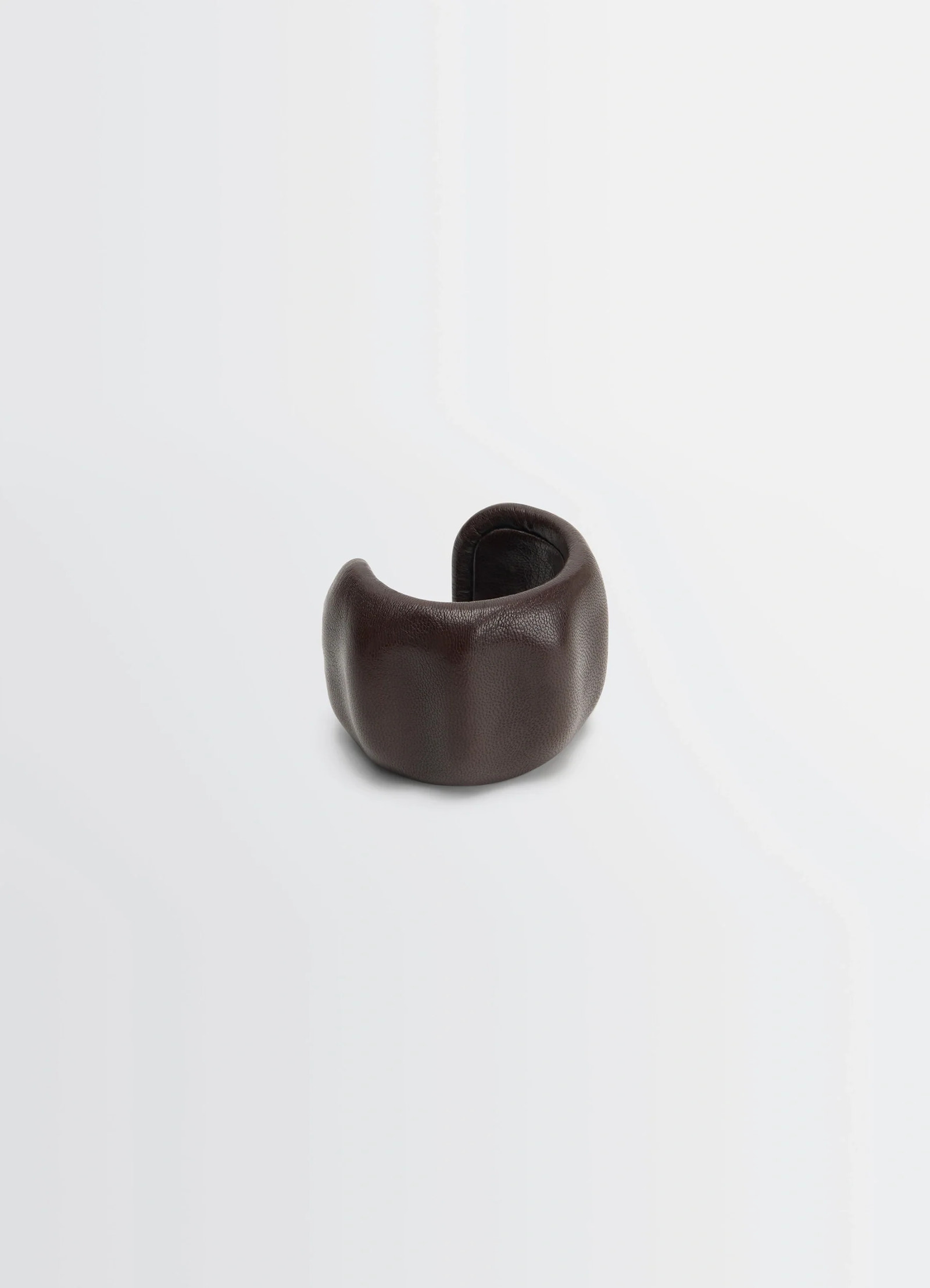 Lemaire carlos cuff in brown goats leather, product shot, angled side view molded organic form