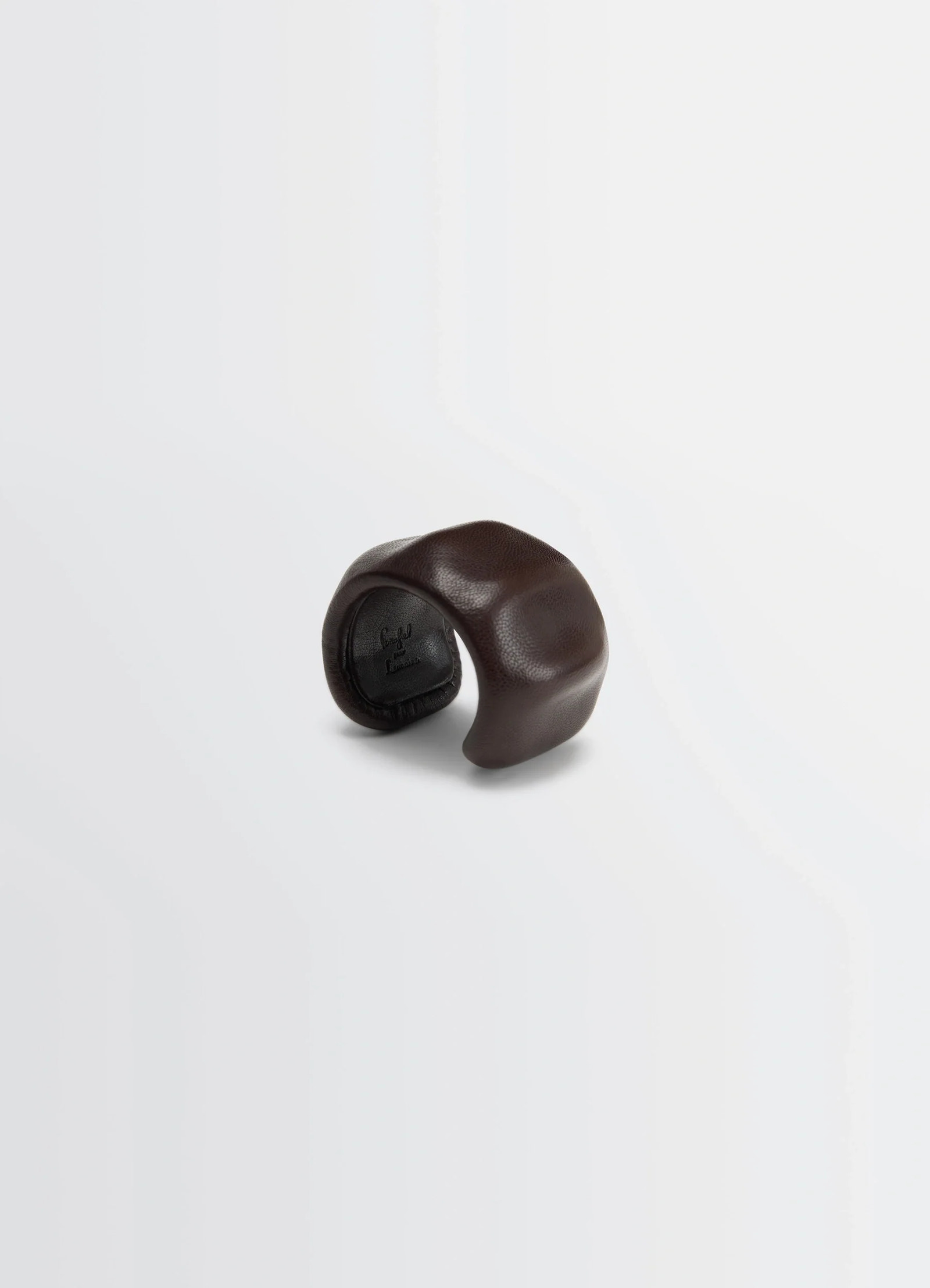 Lemaire carlos cuff in brown goats leather, product shot, top view sculptural curve