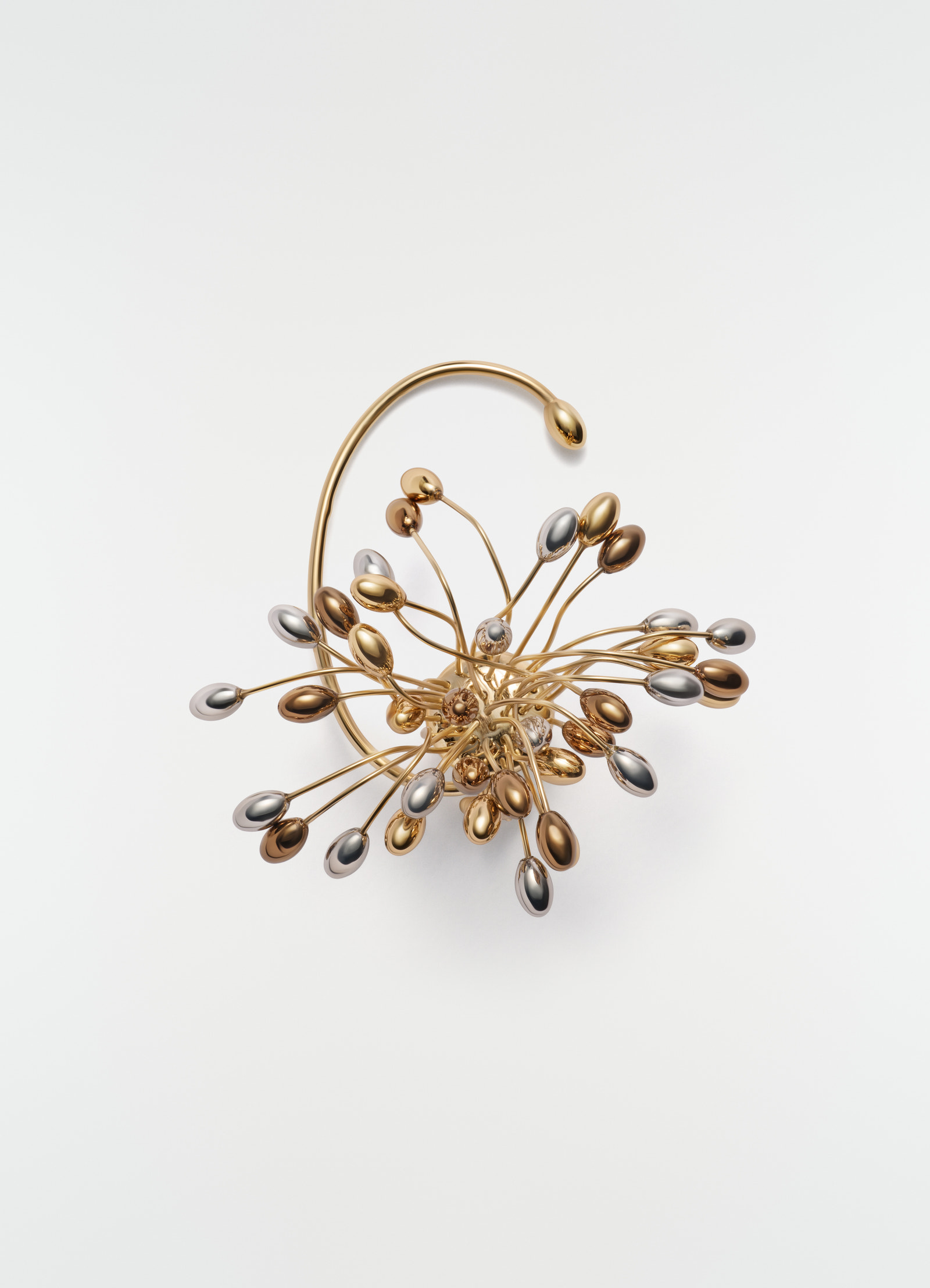 Seeds single earring lemaire gold and silver metallic mixed media close-up on white background