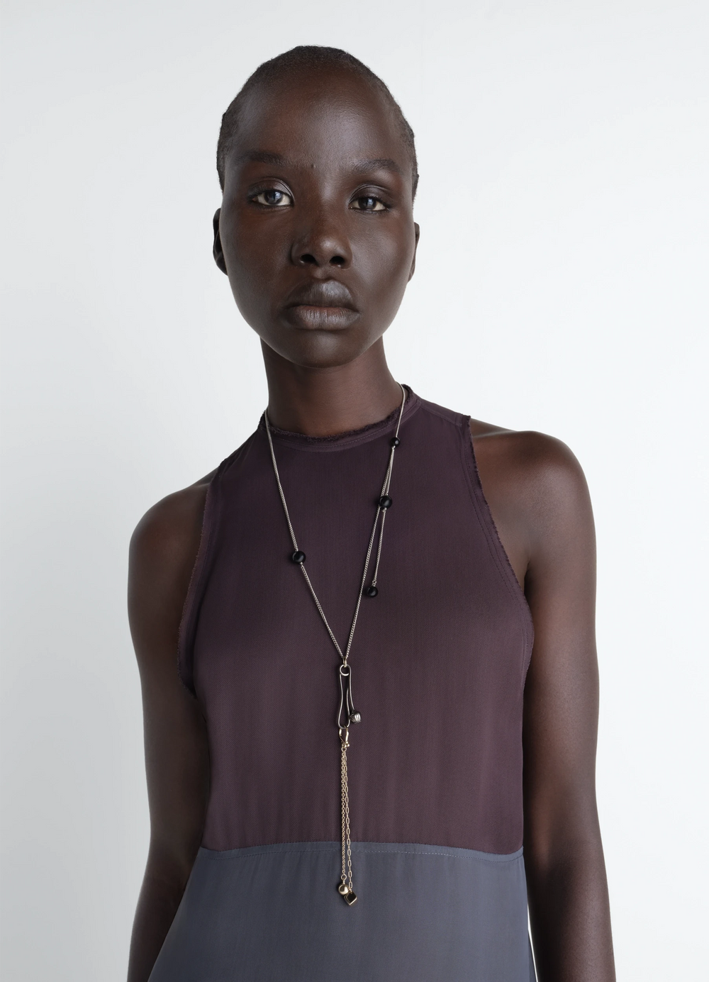 Thistle Necklace in Silver and Gold Metal, model shot, close-up view layered chain design