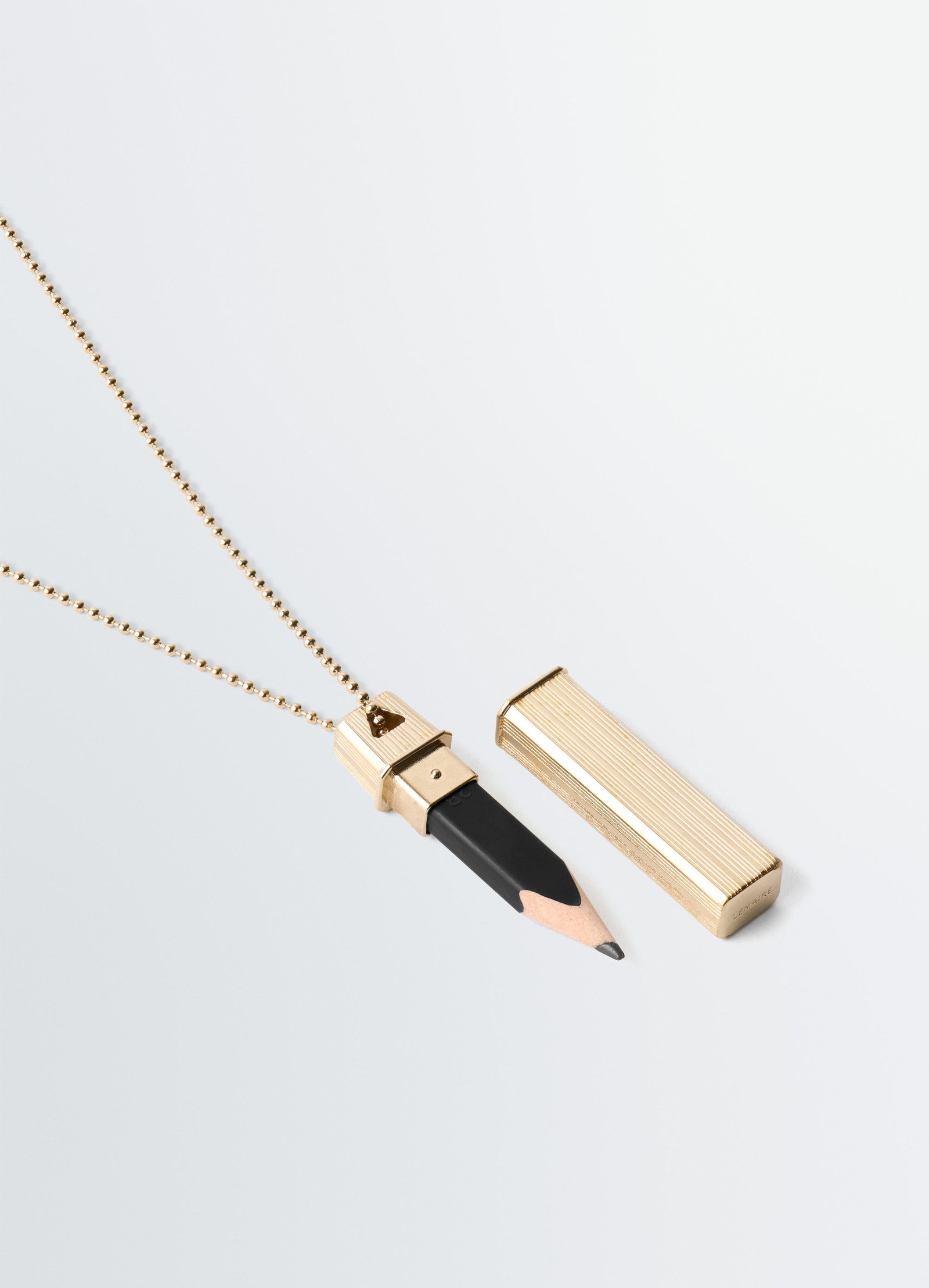 Carpenter pen necklace in brass, product shot, top angle open cap display