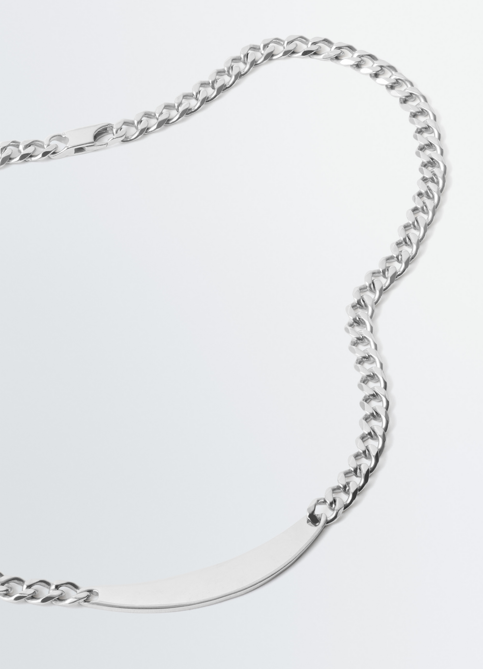 Id necklace in silver in silver sterling, product shot, angled overhead view curb chain design