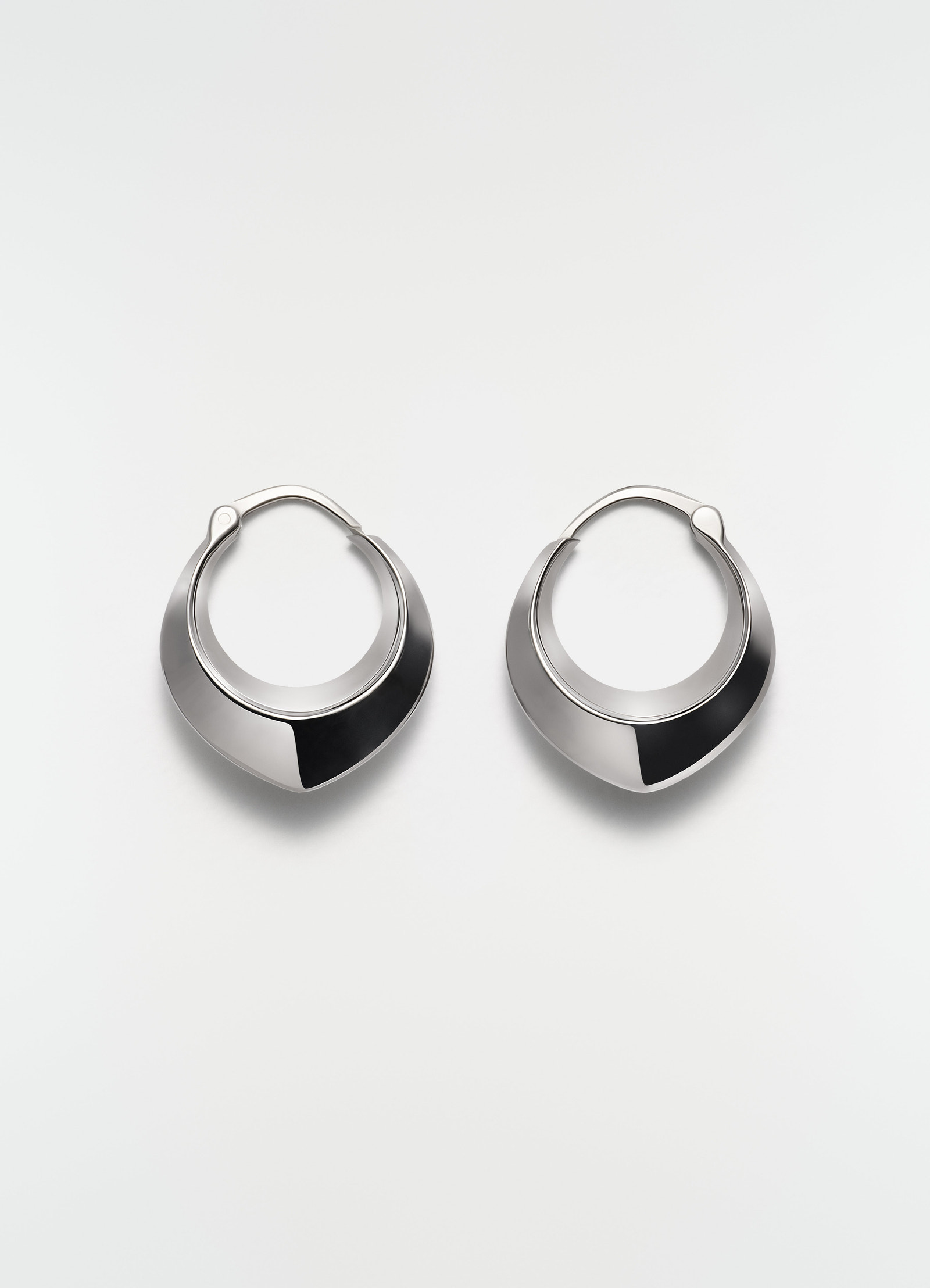 Drop edge hoop earrings rhodium-plated silver by lemaire with smooth finish front view on white background