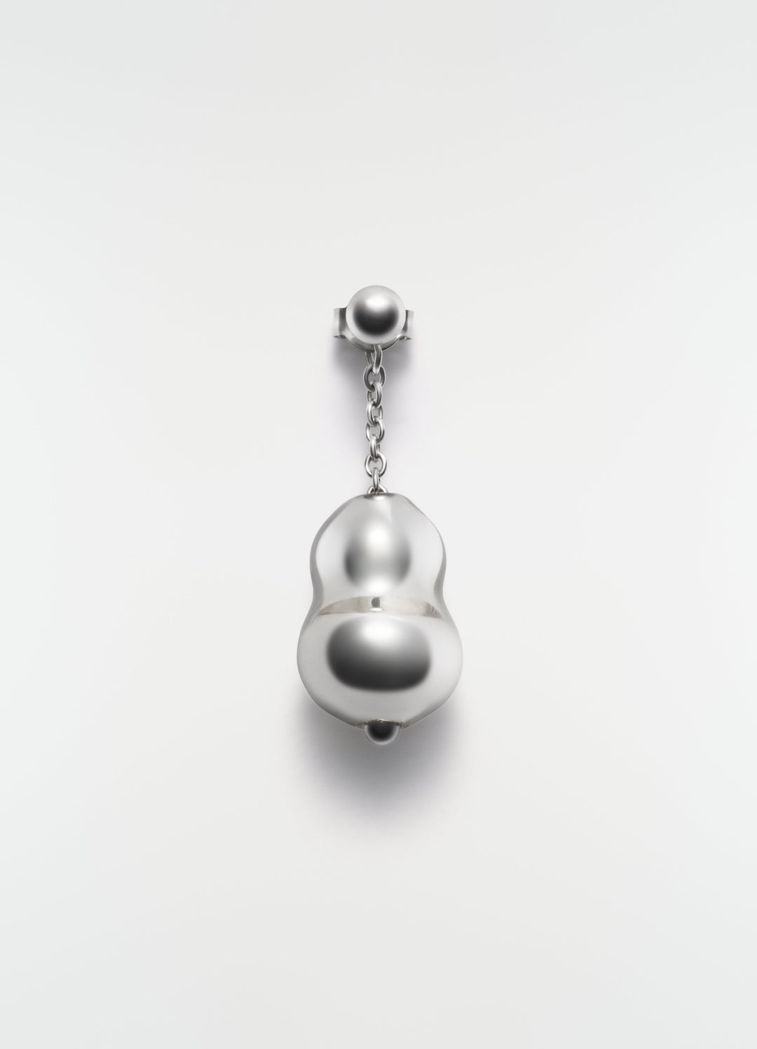 Blown glass silver-tone earring with chain detail by LEMAIRE on plain white background close-up