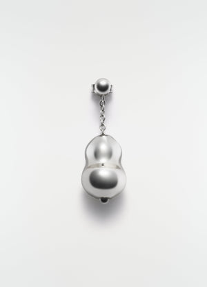 Blown glass silver-tone earring with chain detail by lemaire on plain white background close-up