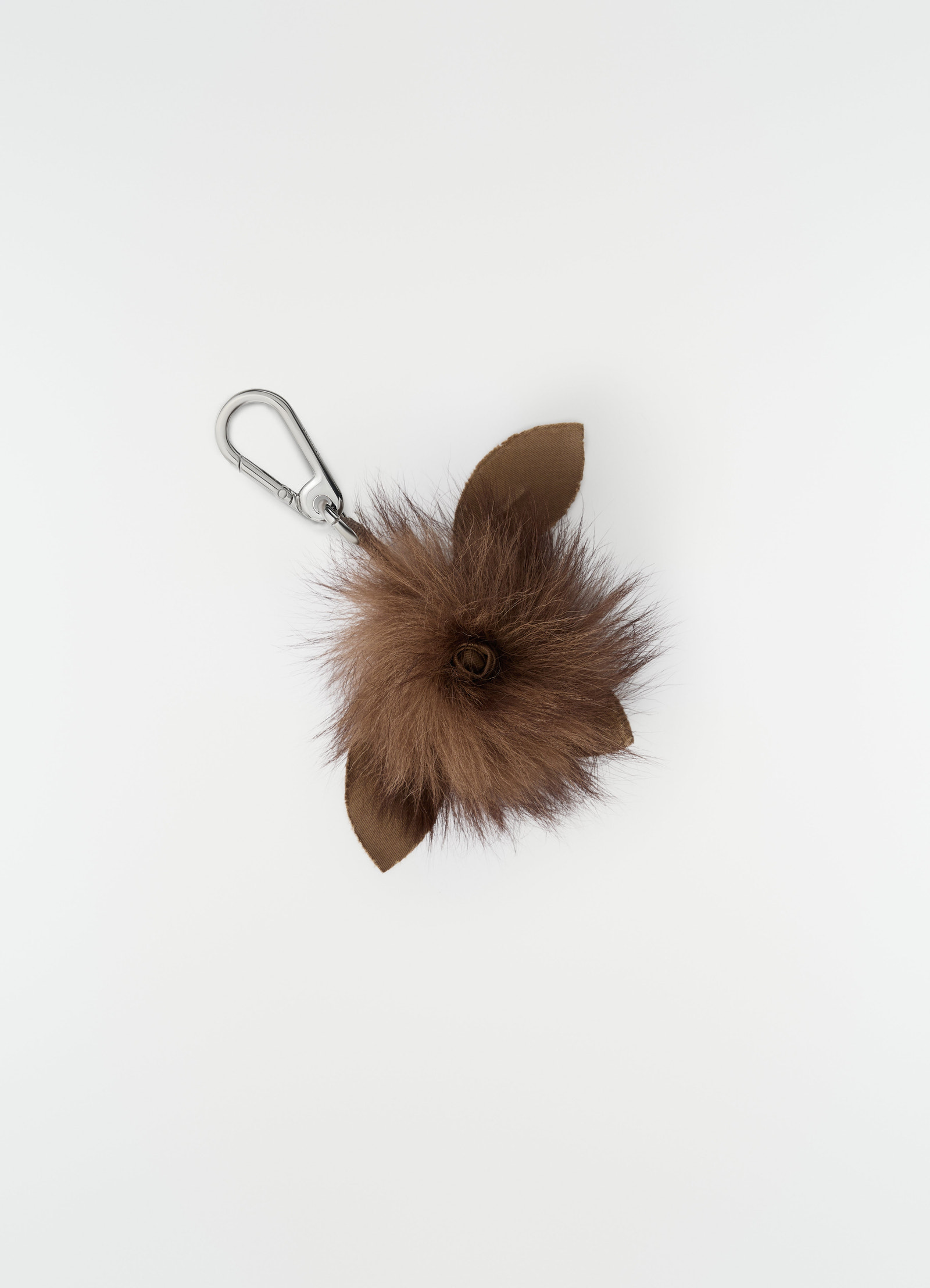 Fuzzy brown lambskin shearling rose brooch lemaire with silver clip on plain white background