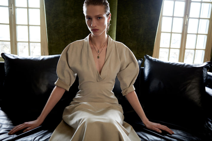 Beige dress in Beige fabric, model shot, Front worn view Puffed sleeves, fitted waist