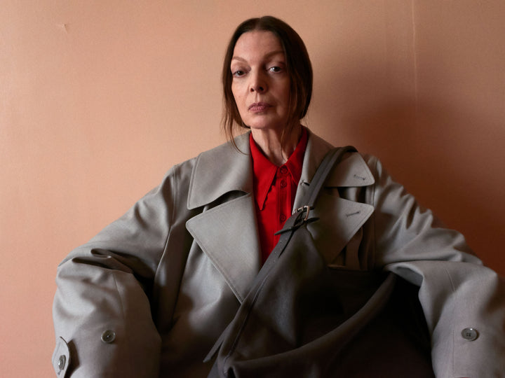 Gray trench coat in gray fabric, model shot, front view oversized