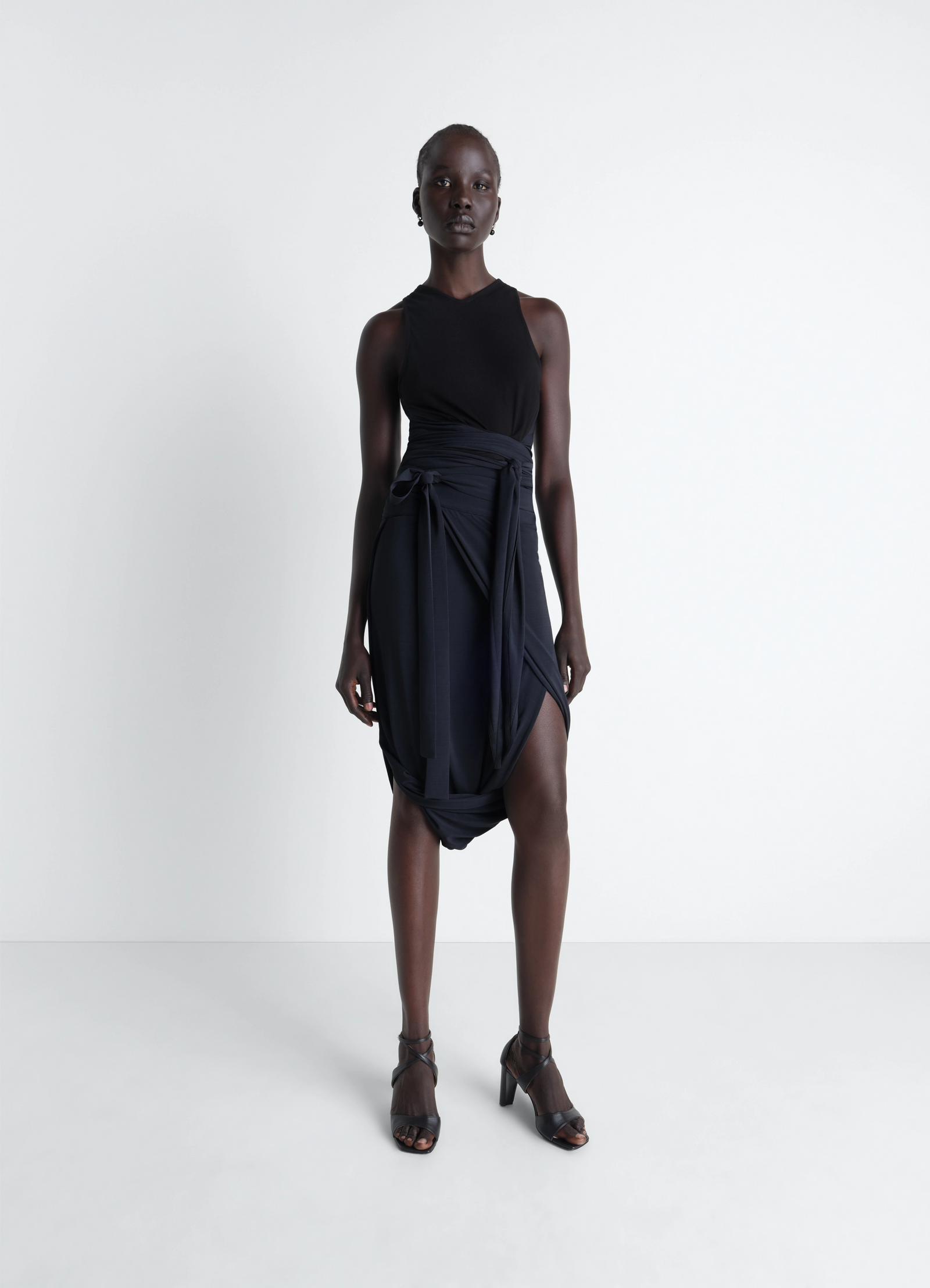 Sleeveless wrap top in viscose crepe jersey, model shot, 3/4 view asymmetrical hem