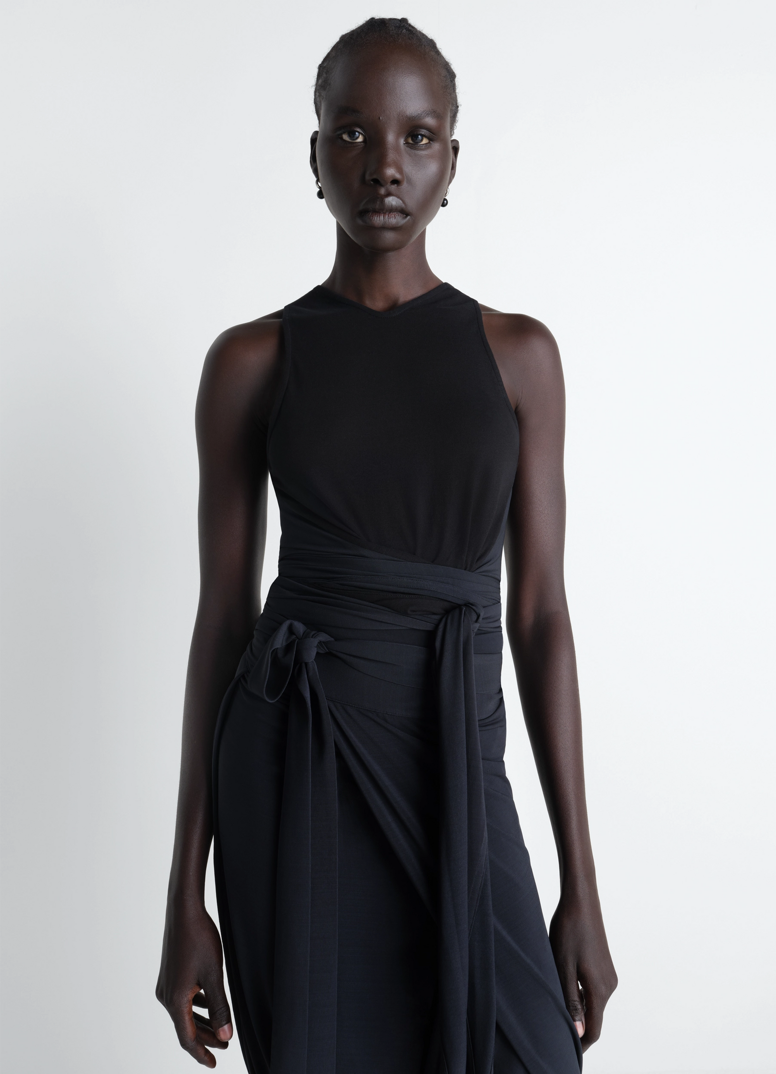 Sleeveless wrap top in viscose crepe jersey, model shot, front view draped wrap style