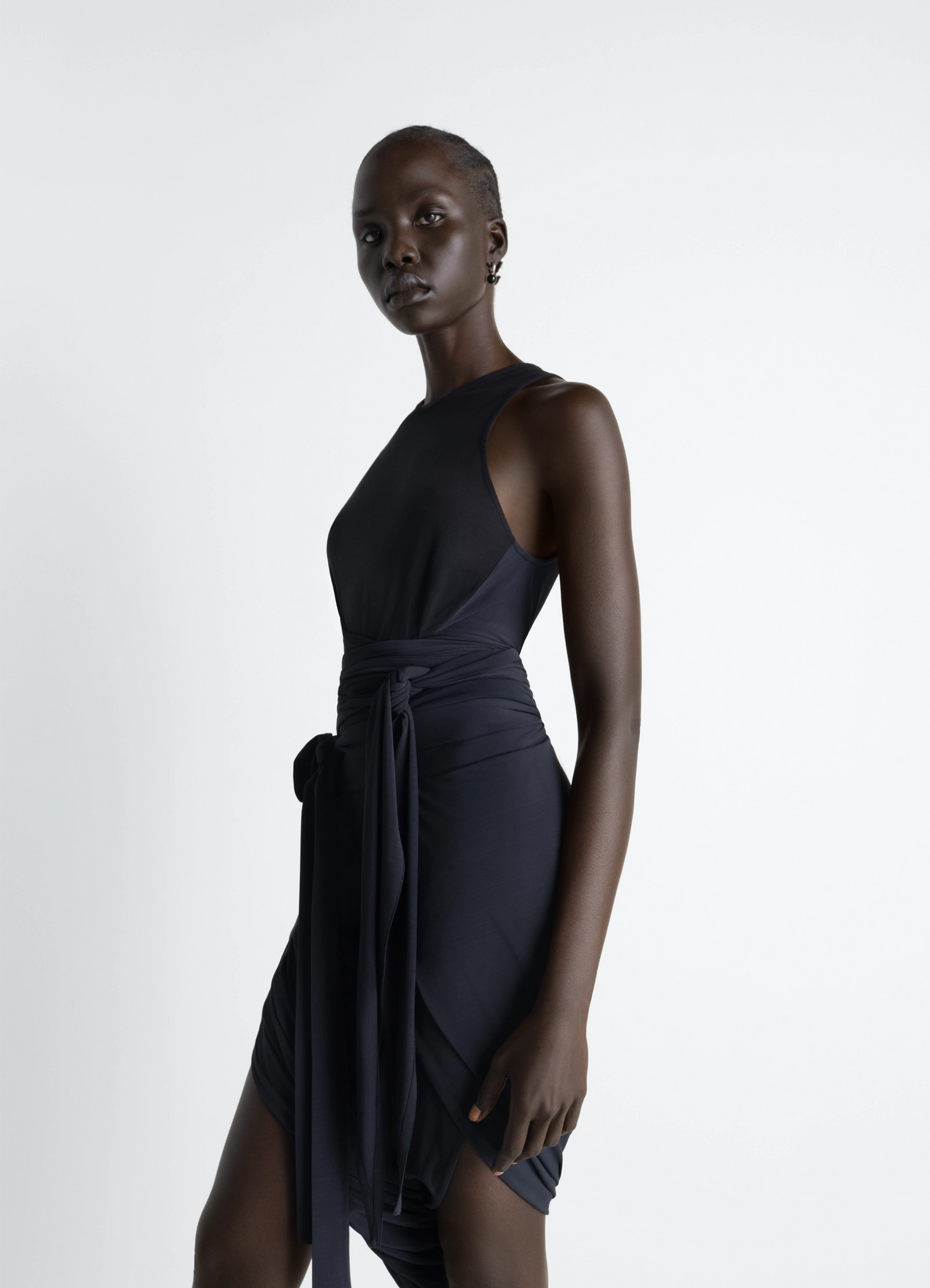 Sleeveless wrap top in viscose crepe jersey, model shot, side view waist tie detail