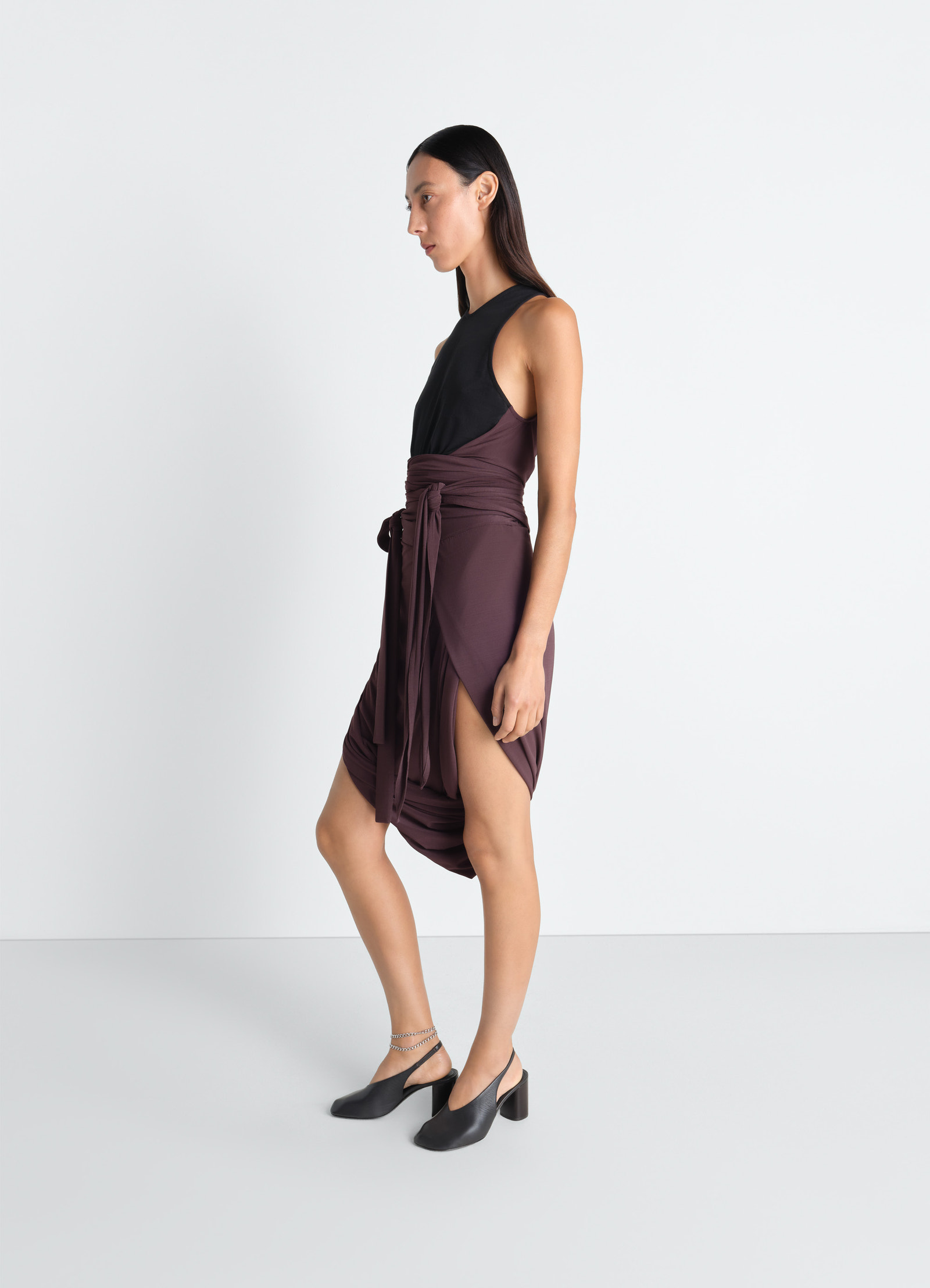 Sleeveless wrap top in viscose crepe jersey, model shot, profile side view waist tie asymmetric hem