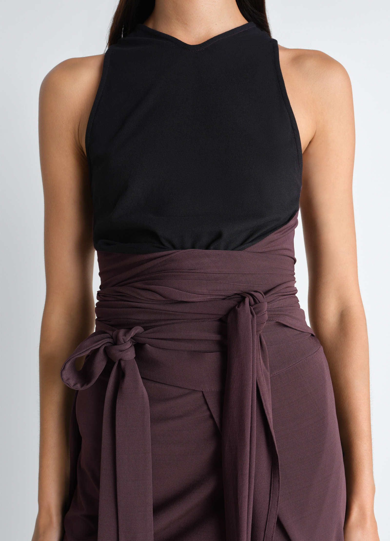 Sleeveless wrap top in viscose crepe jersey, model shot, close-up front waist view layered tie belts
