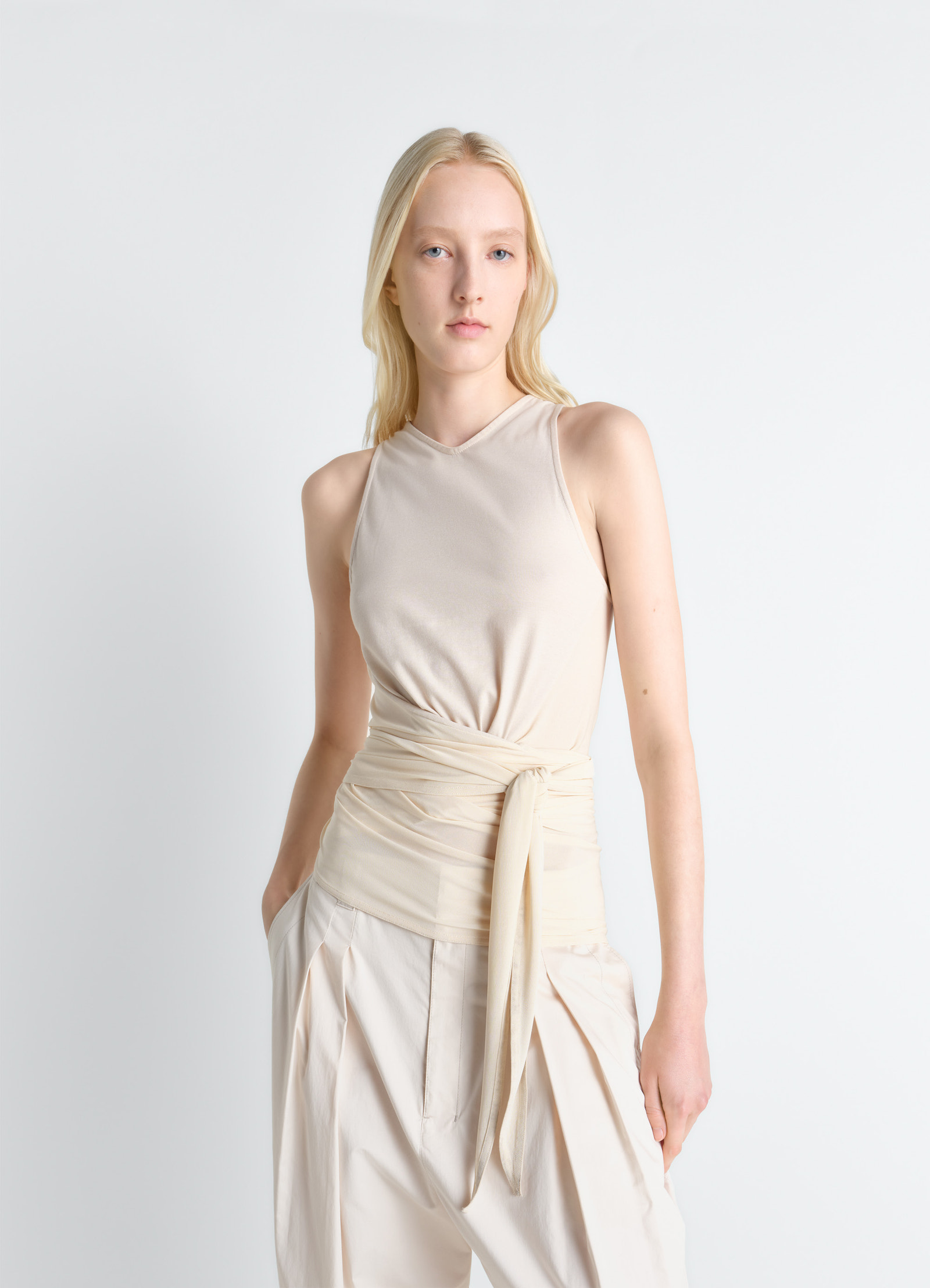 Sleeveless wrap top in viscose crepe jersey, model shot, front view draped fitted cut