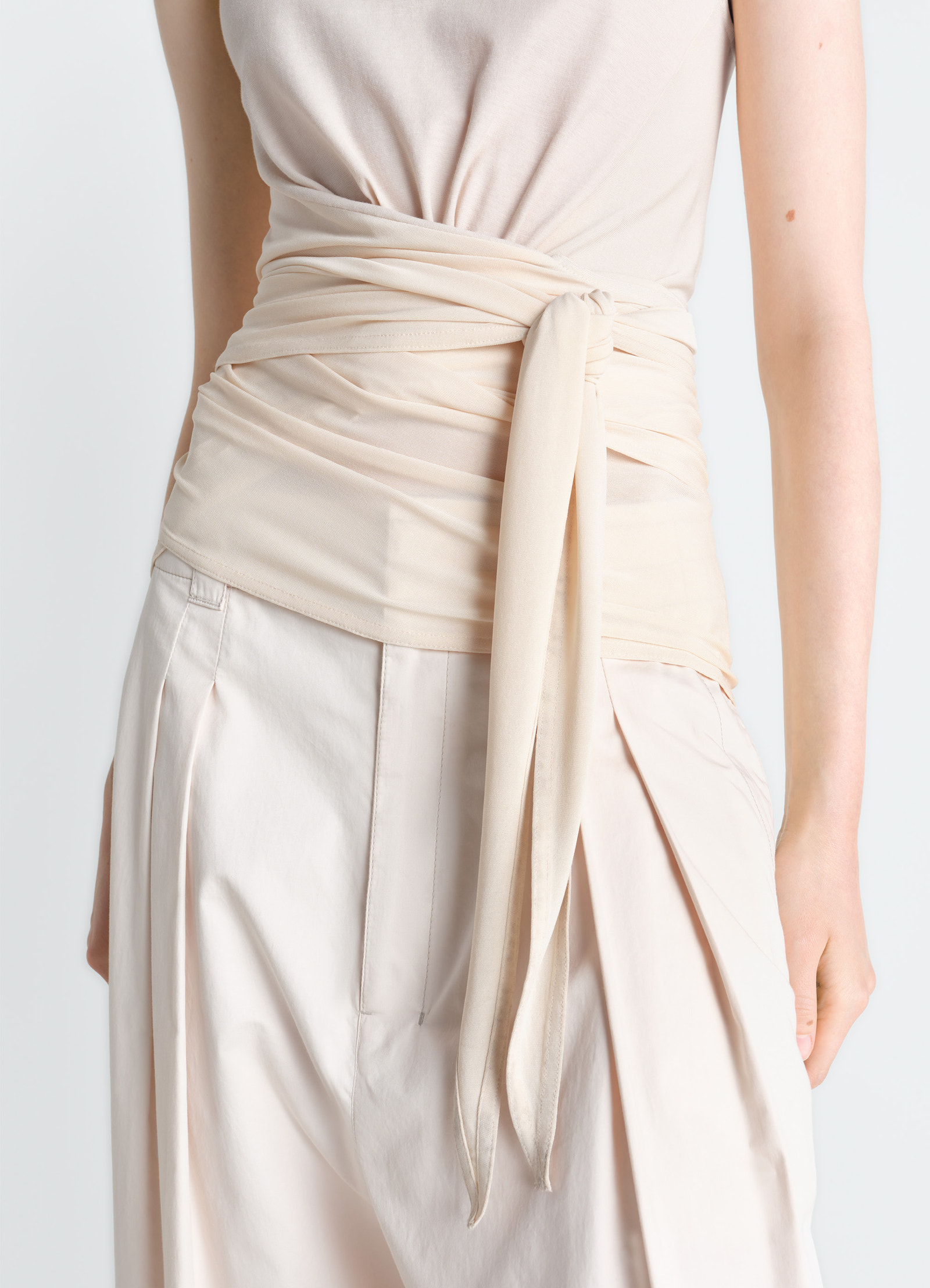 Sleeveless wrap top in viscose crepe jersey, model shot, close-up side view waist wrap detail