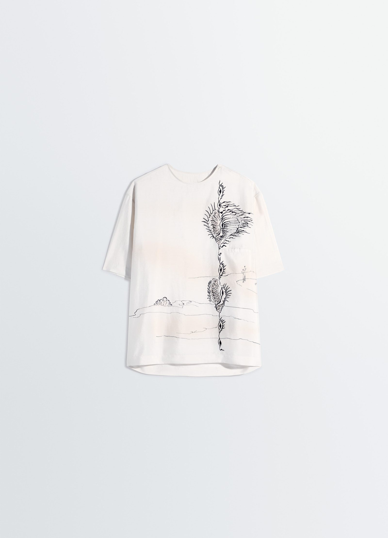Button neck top in shell printed silk, product shot, hanging angled view short sleeves front pattern