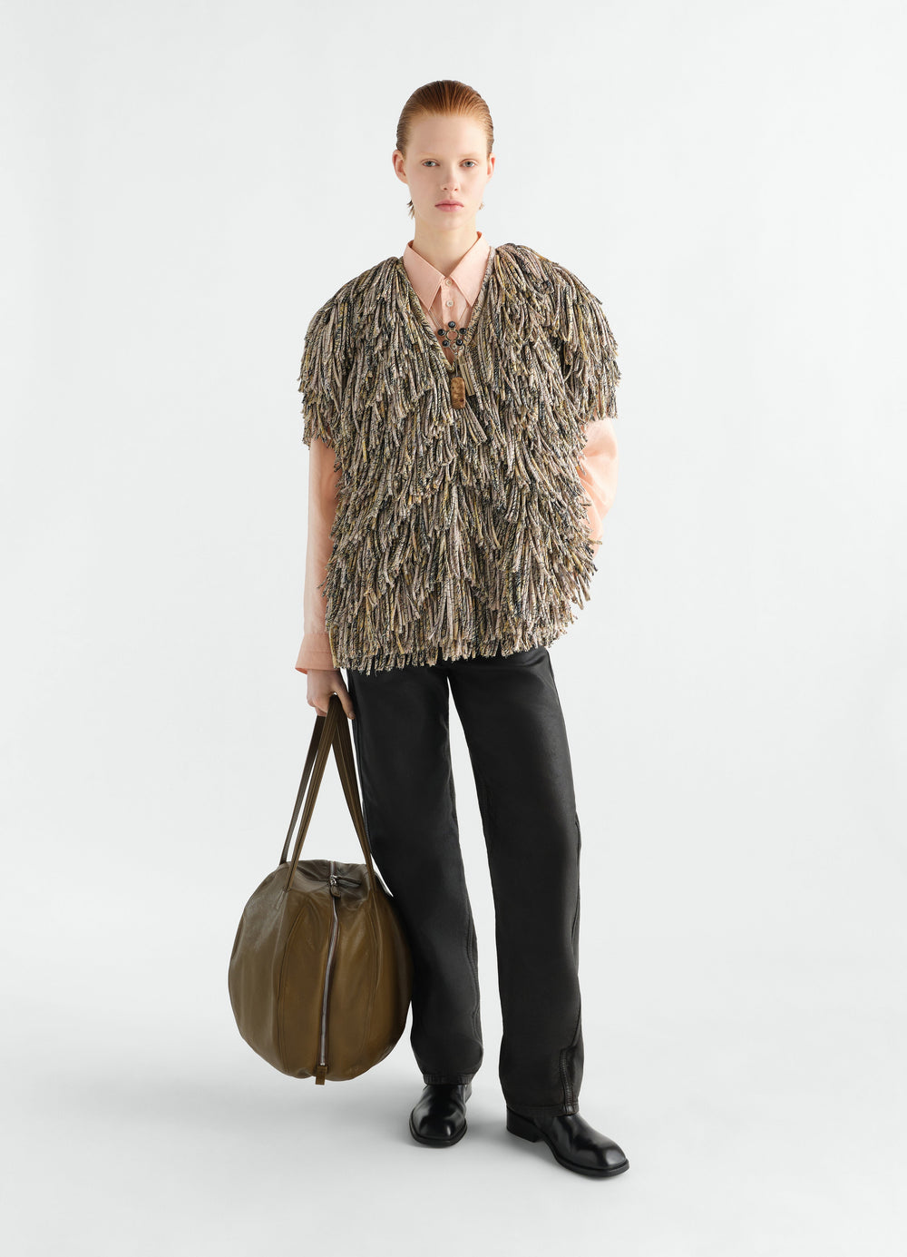 Fringed printed dry silk top in flashback colors worn by model with black pants and olive leather bag LEMAIRE
