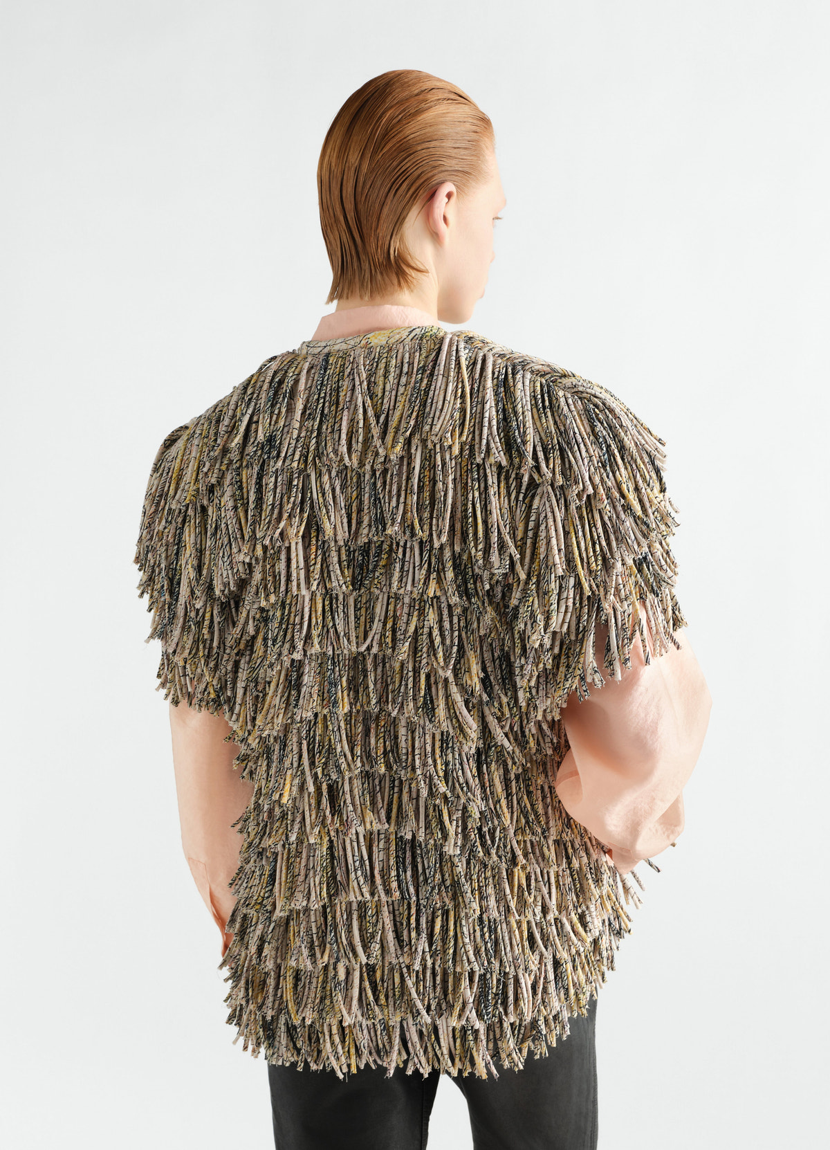 Fringed top in multicolour printed dry silk by lemaire worn by model back view with pink sleeves