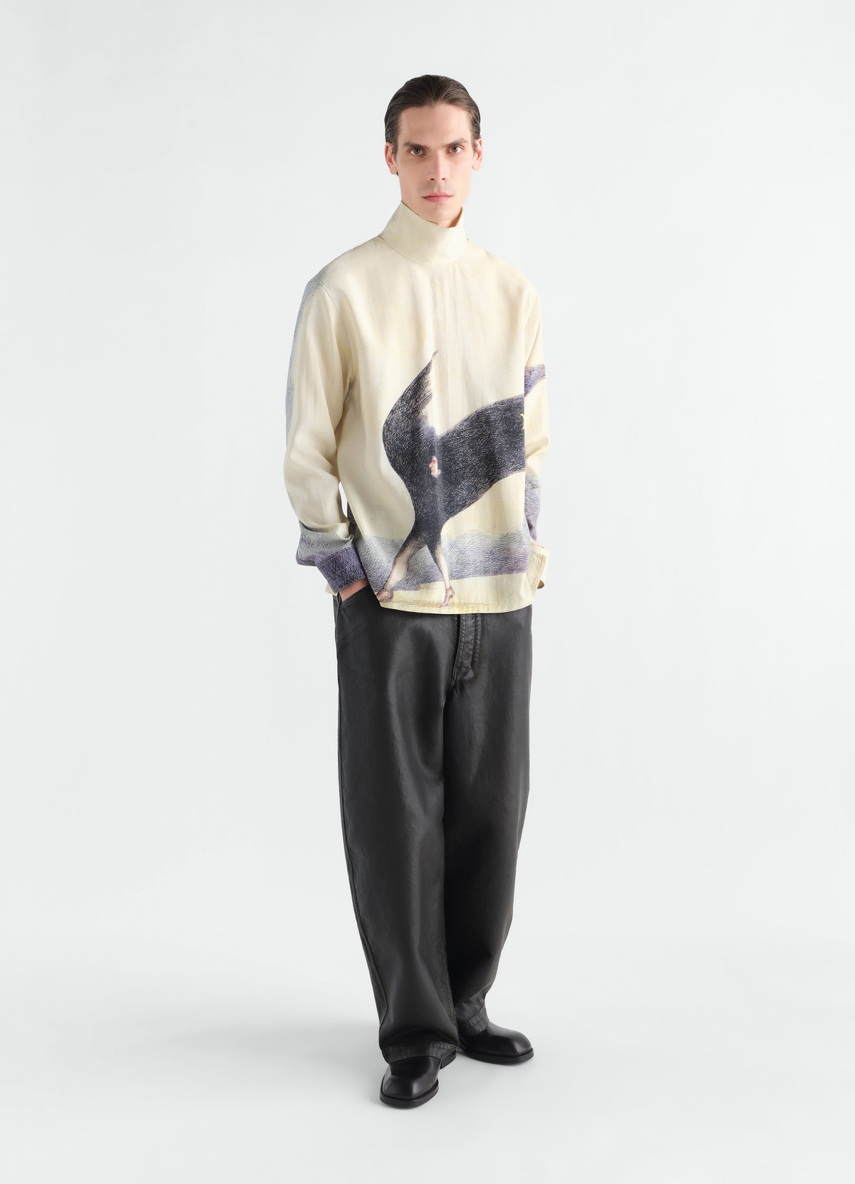 Stand-collar printed silk top in cream with black figure motif, worn by a model front view lemaire