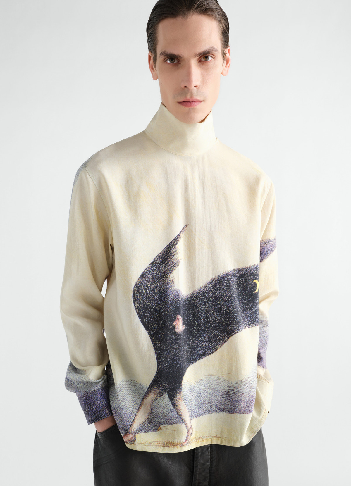 Stand-collar cream silk top with black winged figure print worn by model lemaire
